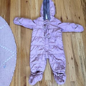 Footed onesie jacket for a baby girl